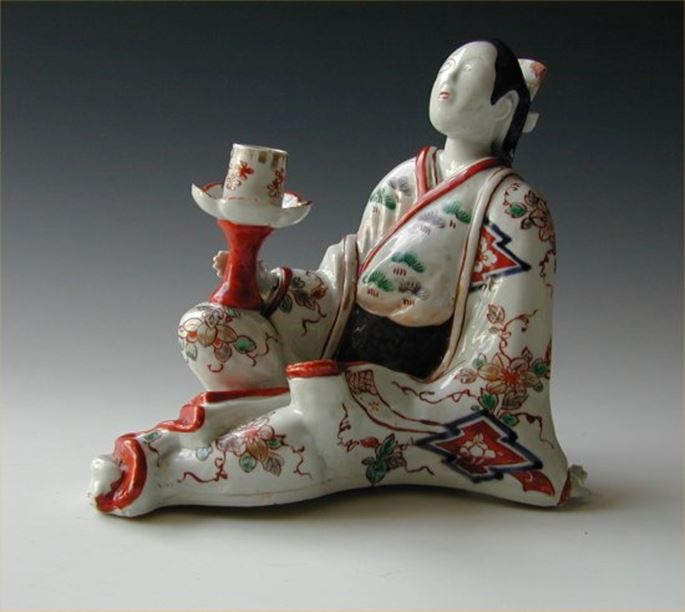 Japanese arita porcelain candlestick modelled as a seated bijin | MasterArt